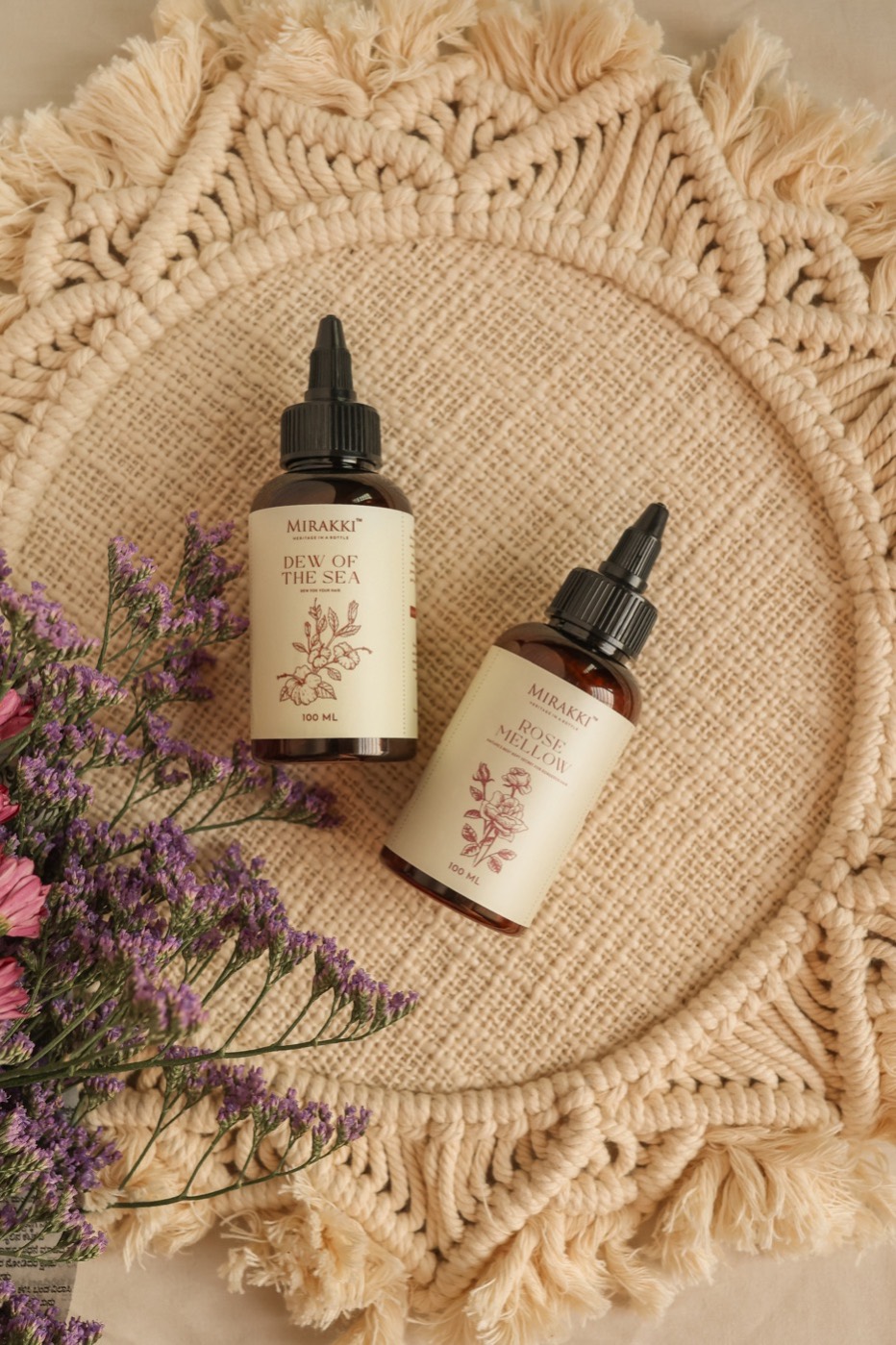 Mirakki botanical oils arranged with flowers